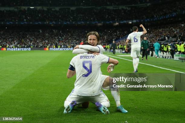 Karim Benzema Real Madrid CF celebrates scoring their third goal with teammate Luka Modric during the UEFA Champions League Round Of Sixteen Leg Two...