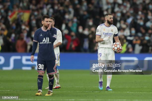 Karim Benzema ri of Real Madrid CF celebrates scoring their opening goal as Lionel Messi of Paris Saint-Germain reacts during the UEFA Champions...