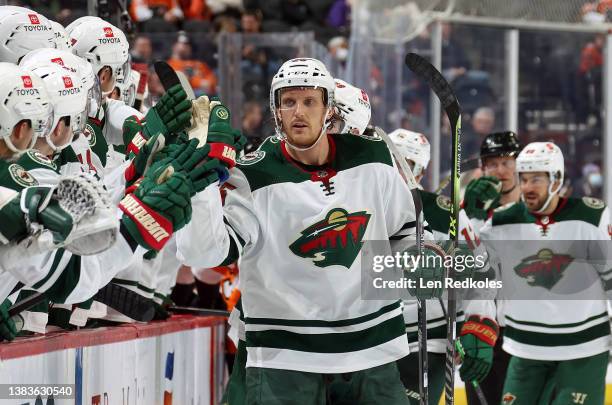 Jonas Brodin of the Minnesota Wild celebrates his third period goal with teammates on the bench against the Philadelphia Flyers at the Wells Fargo...