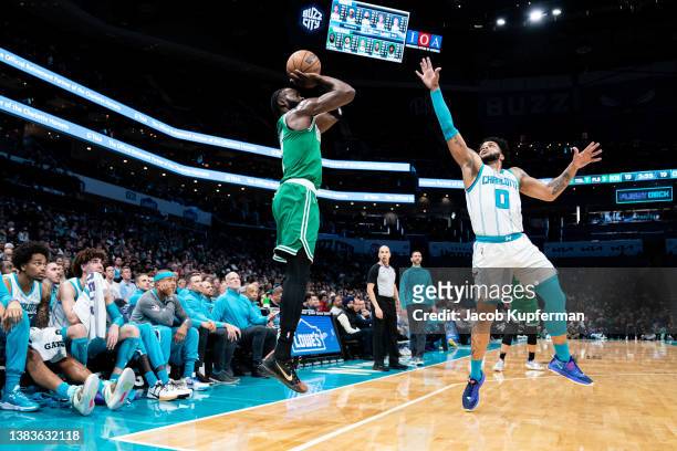 Jaylen Brown of the Boston Celtics shoots the ball over Miles Bridges of the Charlotte Hornets in the first quarter at Spectrum Center on March 09,...