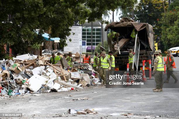 Personnel clean up flood damage in Milton, on March 10, 2022 in Brisbane, Australia. The Federal Government has announced plans to boost numbers in...