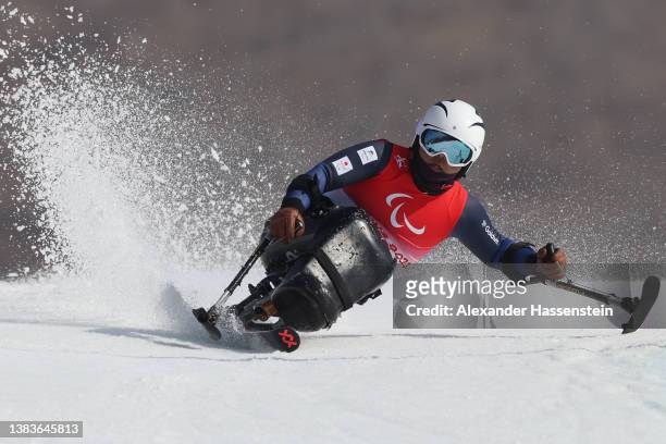 Tetsu Fujiwara of Team Japan competes during the Men's Giant Slalom Sitting Run 1 on day six of the Beijing 2022 Winter Paralympics at Yanqing...