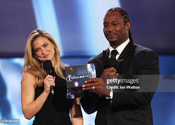 Model Bar Refaeli and Boxer Lennox Lewis speak on stage at the 2012 Laureus World Sports Awards at Central Hall Westminster on February 6, 2012 in...