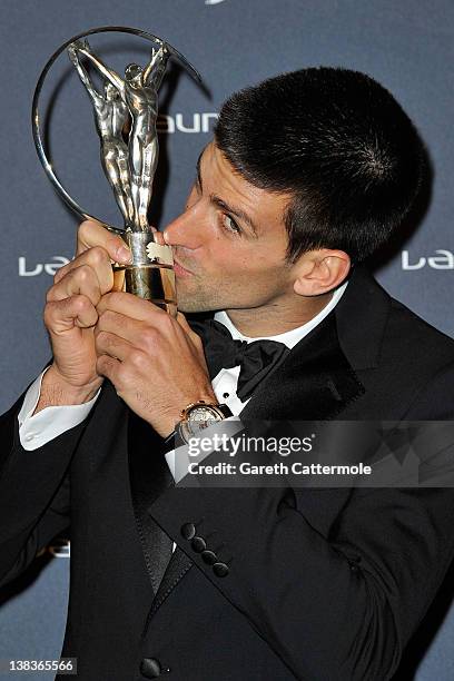 Tennis Player Novak Djokovic poses with his Laureus World Sportsman of the Year trophy in the press room at the 2012 Laureus World Sports Awards at...