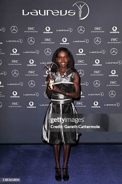 Vivian Cheruiyot poses with her Laureus World Sportswoman of the Year trophy in the press room at the 2012 Laureus World Sports Awards at Queen...