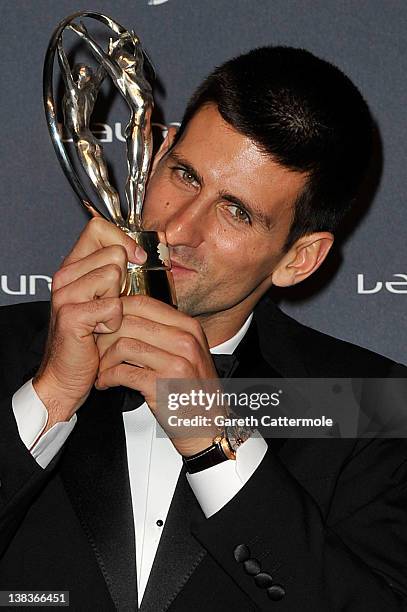 Tennis Player Novak Djokovic poses with his Laureus World Sportsman of the Year trophy in the press room at the 2012 Laureus World Sports Awards at...