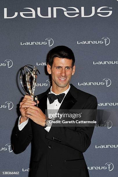 Tennis Player Novak Djokovic poses with his Laureus World Sportsman of the Year trophy in the press room at the 2012 Laureus World Sports Awards at...