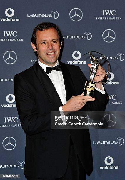 Sandro Rosell, Barcelona Chairman poses with the Laureus World Team of the Year trophy in the press room at the 2012 Laureus World Sports Awards at...