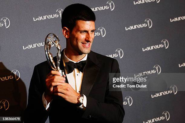 Tennis Player Novak Djokovic poses with his Laureus World Sportsman of the Year trophy in the press room at the 2012 Laureus World Sports Awards at...