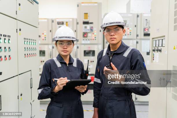 electrical engineer technician in control room - electrical switch stock pictures, royalty-free photos & images