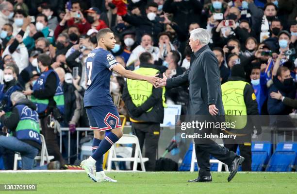 Kylian Mbappe of PSG salutes coach of Real Madrid Carlo Ancelotti following the UEFA Champions League Round Of Sixteen Leg Two match between Real...