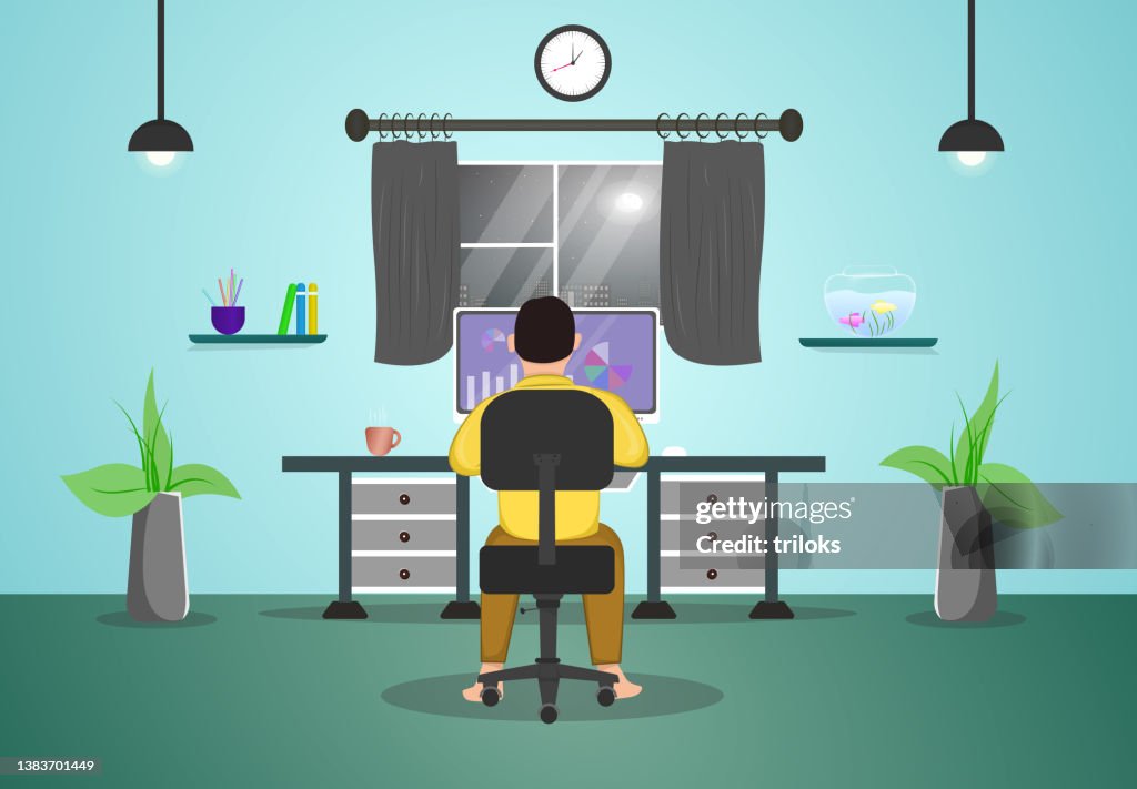 Man working on computer at home office