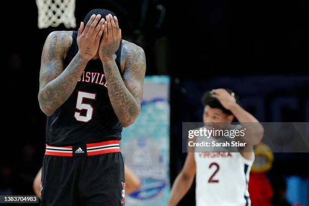 Malik Williams of the Louisville Cardinals reacts during the second half against the Virginia Cavaliers in the 2022 Men's ACC Basketball Tournament -...