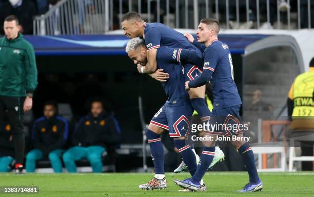 Kylian Mbappe of PSG celebrates his goal with Neymar Jr, Marco Verratti during the UEFA Champions League Round Of Sixteen Leg Two match between Real...