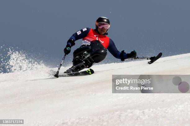 Akira Kano of Team Japan competes during the Men's Giant Slalom Sitting Run 2 on day six of the Beijing 2022 Winter Paralympics at Yanqing National...