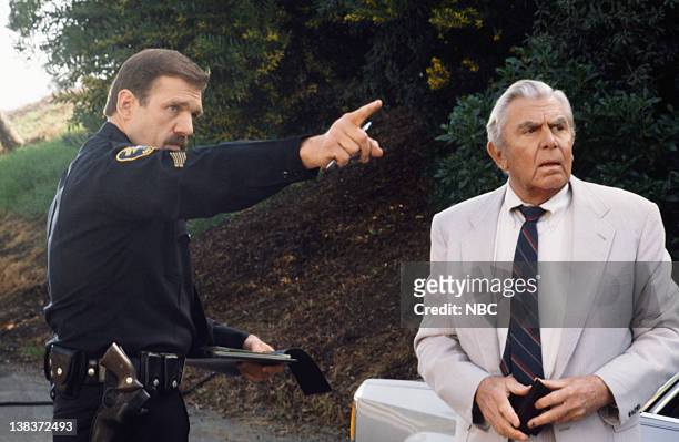 The Evening News: Part 1 & 2" Episode 19 & 20 -- Pictured: Mark Drexler as Police officer, Andy Griffith as Benjamin Matlock