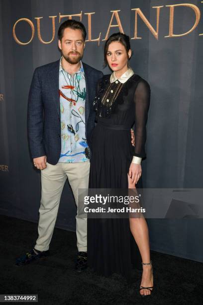 Richard Rankin and Sophie Skelton arrive at the Season 6 Premiere of STARZ 'Outlander' at The Wolf Theater at the Television Academy on March 09,...