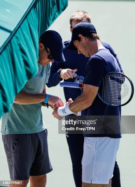 Andy Murray of Great Britain has treatment for a hand injury during a practice session before the start of the BNP Paribas Open on March 09, 2022 in...