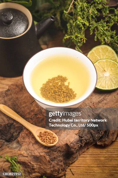 a cup of tartary buckwheat tea on the wooden bottom - tartary buckwheat stock pictures, royalty-free photos & images