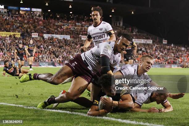 Izack Tago of the Panthers score a try during the round one NRL match between the Penrith Panthers and the Manly Sea Eagles at BlueBet Stadium on...