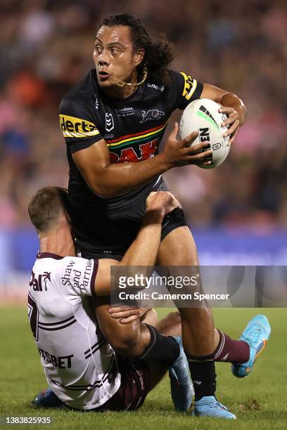 Jarome Luai of the Panthers is tackled by Daly Cherry-Evans of the Sea Eagles during the round one NRL match between the Penrith Panthers and the...