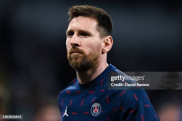 Lionel Messi of Paris Saint-Germain looks on during the warm up prior to the UEFA Champions League Round Of Sixteen Leg Two match between Real Madrid...