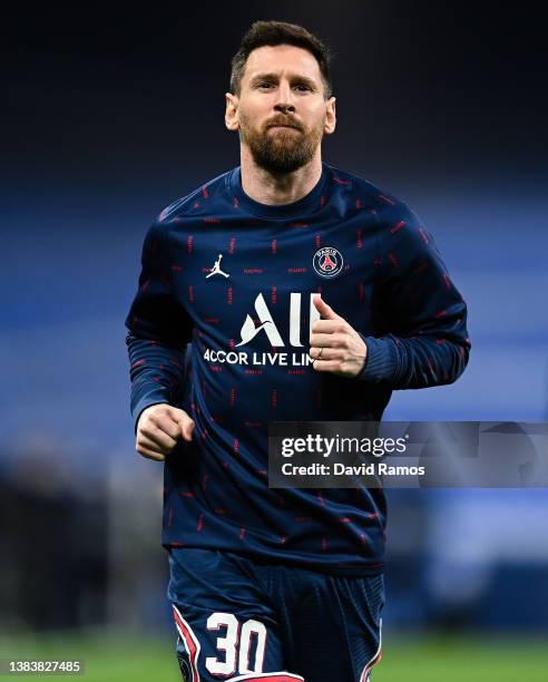 Lionel Messi of Paris Saint-Germain looks on during the warm up prior to the UEFA Champions League Round Of Sixteen Leg Two match between Real Madrid...