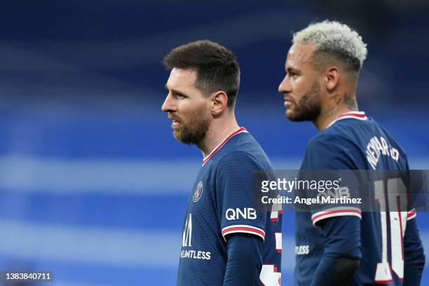 Lionel Messi and Neymar Jr of Paris Saint-Germain look on during the UEFA Champions League Round Of Sixteen Leg Two match between Real Madrid and...