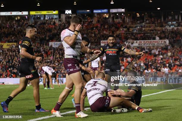 Liam Martin of the Panthers scores a try during the round one NRL match between the Penrith Panthers and the Manly Sea Eagles at BlueBet Stadium on...