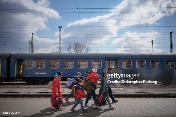 Refugees fleeing Ukraine arrive at the border train station of Zahony on March 10, 2022 in Zahony, Hungary. More than 2 million refugees have fled...