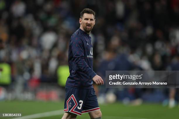 Lionel Messi of Paris Saint-Germain reacts as he warms up before the UEFA Champions League Round Of Sixteen Leg Two match between Real Madrid and...