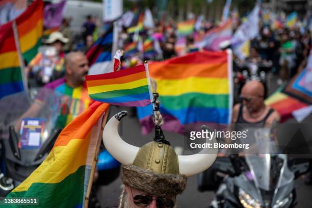 Participants carry rainbow flags and march during The Pride in London Parade in London, UK, on Saturday, July 1, 2023. Pride flags are flying over...
