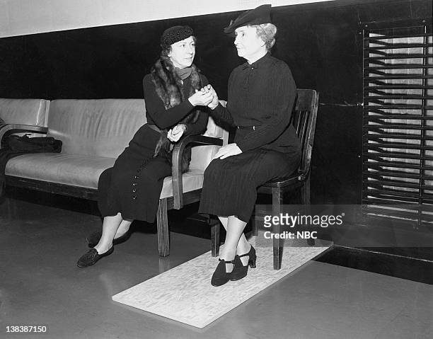 Pictured: Aid/companion Polly Thompson, Helen Keller listening to the NBC Symphony by using a special listening board in 1938