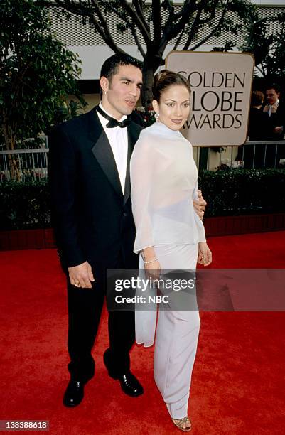 Pictured: Jennifer Lopez arrives with guest at the 55th Annual Golden Globe Awards held at the Beverly Hilton Hotel on January 18, 1998