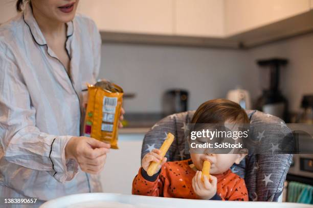 yummy snack - asian baby eating stock pictures, royalty-free photos & images