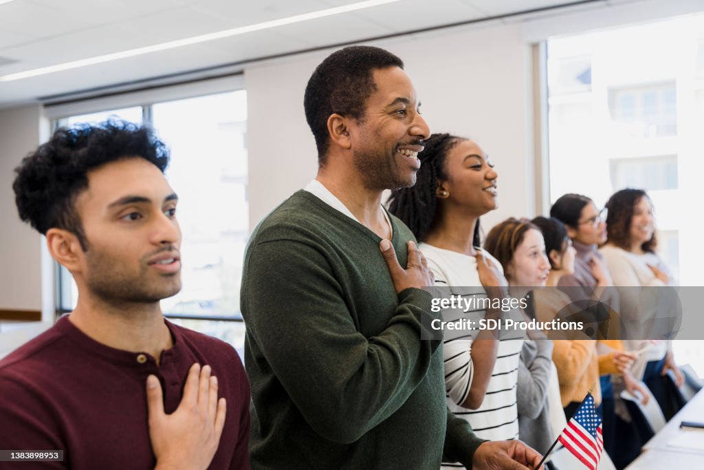 Class stands and recites