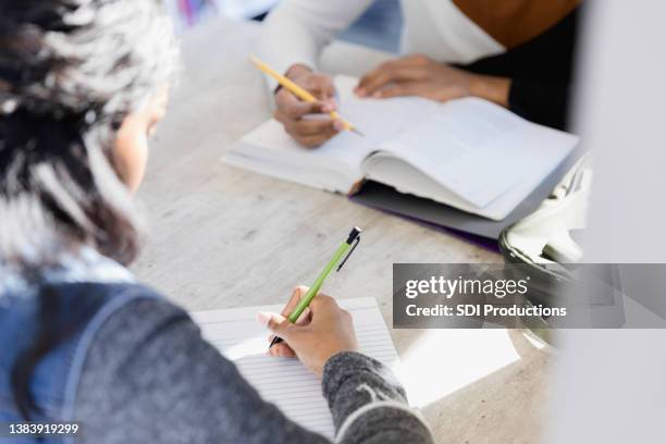 unrecognizeable students study - couple school stockfoto's en -beelden