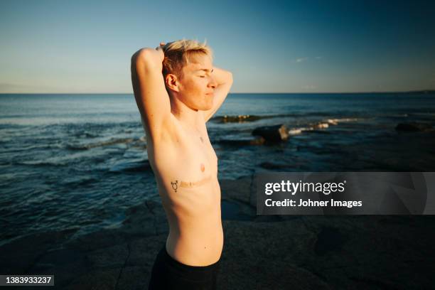 person with transgender tattoo on naked chest - transgender bildbanksfoton och bilder