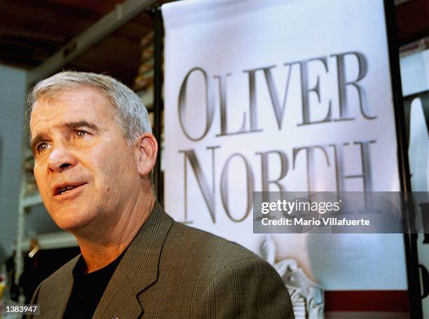 Retired Marine Lt. Col. Oliver North, author of the current best selling book 'Mission Compromised', speaks with local reporters during a book...