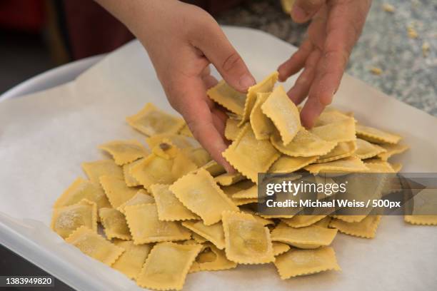 chef preparing ravioli pasta to be cooked,rome,italy - ravioli stock-fotos und bilder