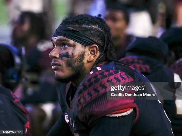 Defensive End Jermaine Johnson II of the Florida State Seminoles sitsnon the sidelines during the game against the NC State Wolfpack at Doak Campbell...