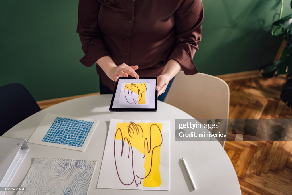 An Anonymous Plus Size Female Graphic Designer Working on a New Project from Home Office (Copy Space)