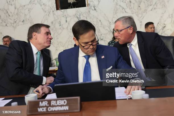 Chairman Sen. Mark Warner , Vice Chairman Sen. Marco Rubio and Sen. Richard Burr talk during a Senate Intelligence Committee hearing on March 10,...