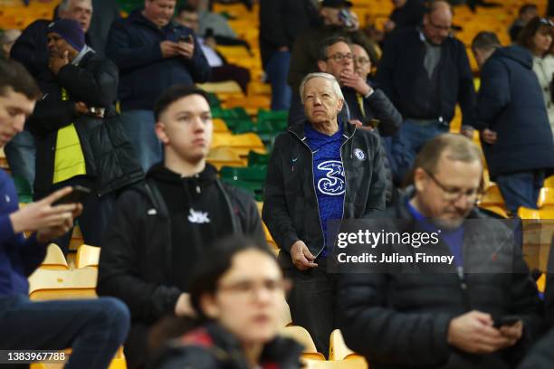 Chelsea fan wearing the home shirt, featuring the Three logo, looks on prior to the Premier League match between Norwich City and Chelsea at Carrow...