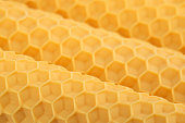 candles made of yellow natural wax with a honeycomb texture