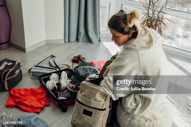 woman packing her luggage - ukrainian culture stock pictures, royalty-free photos & images