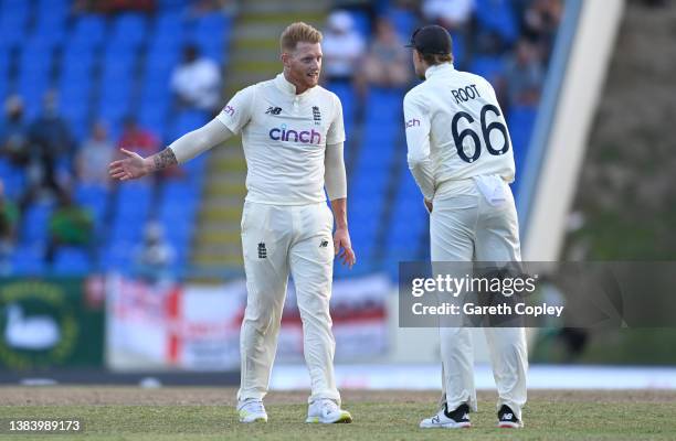 Ben Stokes of England speaks with captain Joe Root during day three of the first test match between West Indies and England at Sir Vivian Richards...