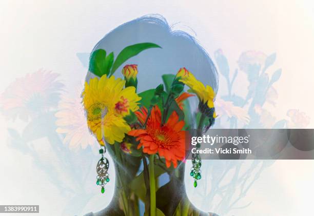 multiple exposure of a woman's head behind flowers - digital composite woman stock pictures, royalty-free photos & images