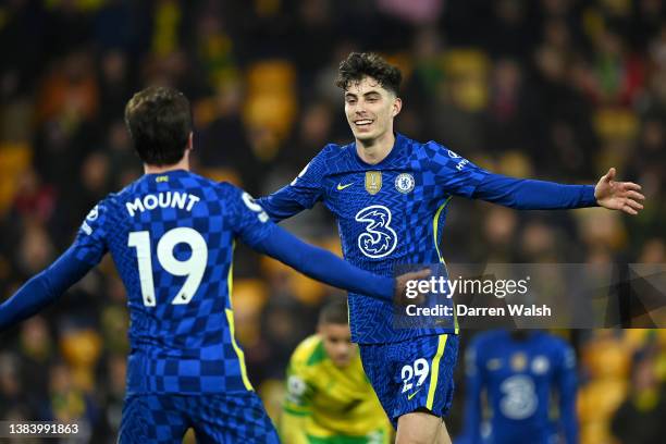 Kai Havertz celebrates with Mason Mount of Chelsea after scoring their team's third goal during the Premier League match between Norwich City and...