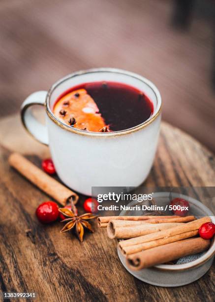 close-up of drink with spices on table,latvia - hot beverage stock-fotos und bilder